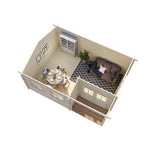 Interiörbild av ett trädgårdshus i trä med möbler