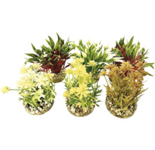 Tre konstgjorda växter i krukor med småsten