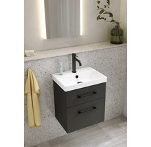 Tvättställ med underskåp och två lådor i badrummet.