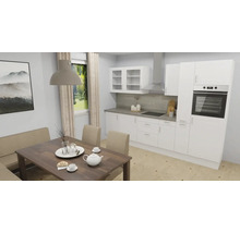 Ljust kök med matbord och bänk