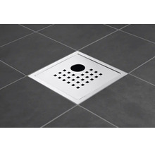 Fyrkantigt golvbrunn i metall på kakel