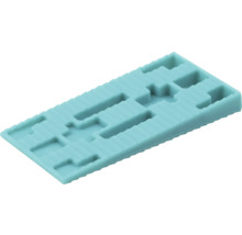 Rektangulär glasningskloss av plast med urtag för precisionsmontering av fönster och utjämning.