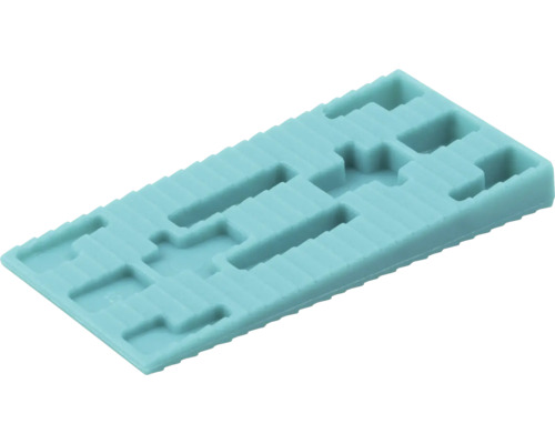 Rektangulär glasningskloss av plast med urtag för precisionsmontering av fönster och utjämning.