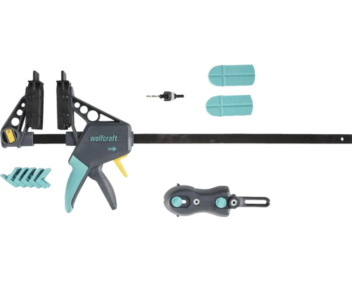 Wolfcraft enhandsving med tillbehörssats bestående av borr, skyddskåpor och adaptrar.