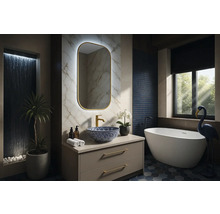 Modernt badrum med tvättställ, spegel, badkar och dekoration