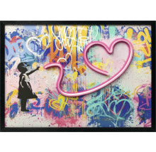 Inramad väggkonst med flickas silhuett och hjärtmotiv