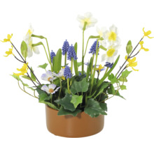 Blomsterarrangemang med påskliljor, pärlhyacinter och gula prydnadsblommor i kruka