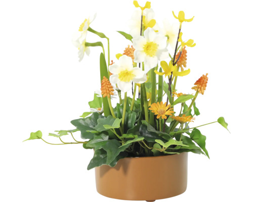 Konstgjord blomsterbukett med påskliljor i en kruka