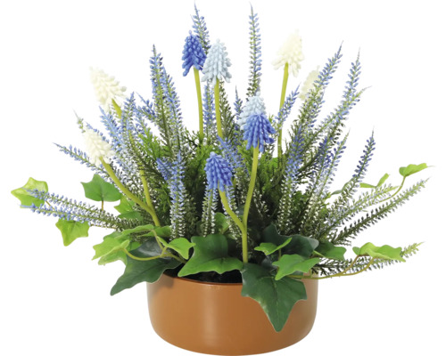 Dekorativ konstgjord växt med blåa och vita blommor i en kruka