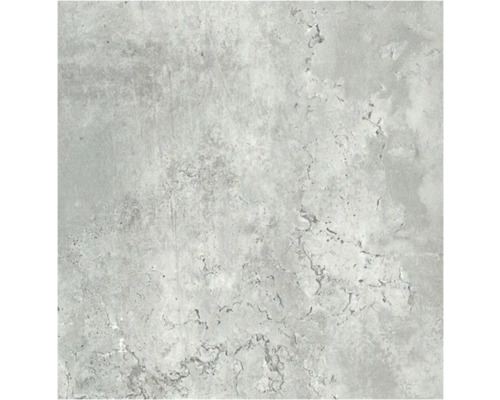 Närbild av en platta med betonglook och oregelbunden struktur.