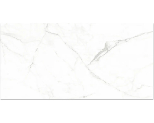 Vit klinker i granitkeramik med marmorlook och grå ådring.