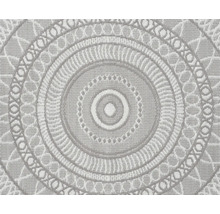 Rund matta med cirkelformat mandalamönster och vävd ytstruktur.
