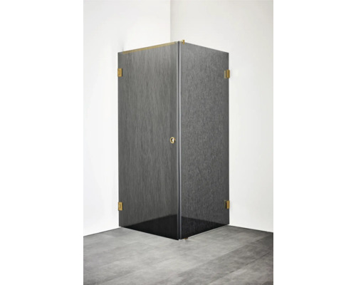 Hörnduschkabin med mörkt strukturerat glas och guldfärgade beslag.