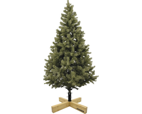 Konstgjord julgran med gröna barr på en julgransfot av trä från Krinner.