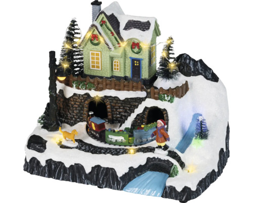 Animerad julby med snötäckt berg, belyst hus, rörligt tåg, figurer och LED-belysning.