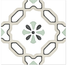 Kvadratisk klinkerplatta med geometriskt mönster och centralt blommotiv i grönt och grått.