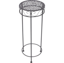 Rund blompall av metall med dekorativt hålmönster och ornament.