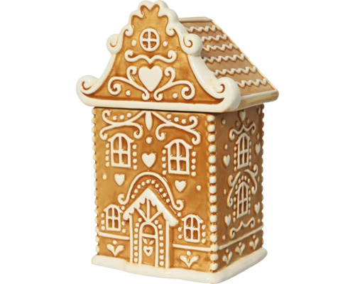 Pepparkakshus i keramik med vit kristyrdekor och hjärtmotiv.