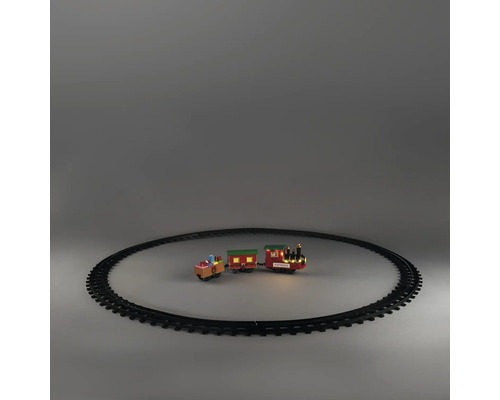 Jultåg med lok, två vagnar och cirkulär räls. Lok med LED-belysning och texten Express.