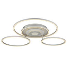 Modern taklampa med tre runda ljusringar och en central bas med glittereffekt av metall.