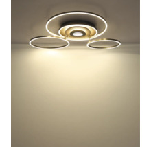 Modern LED-taklampa med flera cirkelformade ljuselement.