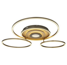 Modern LED-taklampa i metall med tre ringformade ljuselement och ett centralt runt ljuselement med glittereffekt.