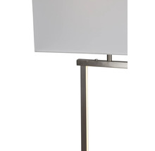 Närbild av en modern lampa med rektangulär textilskärm och metallram med integrerad LED ljuskälla.