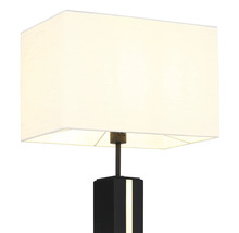 Modern bordslampa med rektangulär textilskärm och svart bas med integrerad ljuslist.