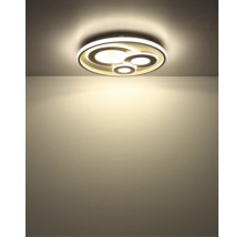 Rund LED-taklampa med fyra sammanflätade lysande ringar i olika storlekar.
