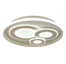 Rund LED-taklampa med tre överlappande ljusringar i olika storlekar.