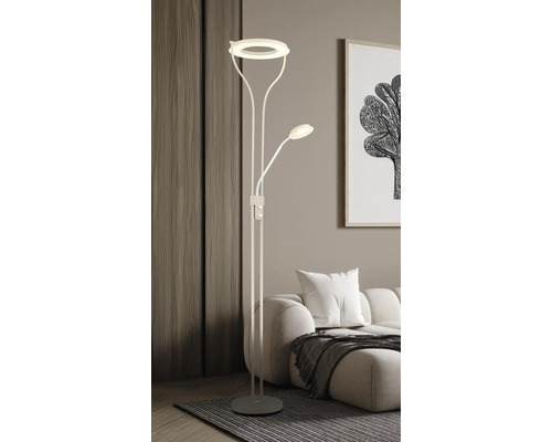 Modern LED-golvlampa med ringformad uplight och flexibel läsarm i ett ljust vardagsrum med soffa.