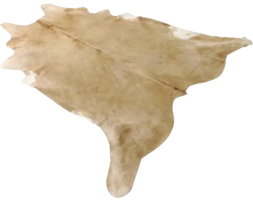Kohudsmatta av äkta päls i beige med naturlig form.