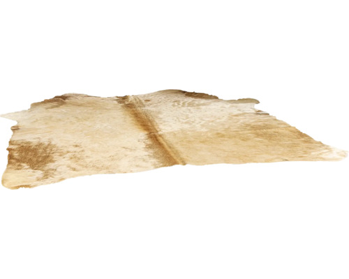 Kohudsmatta av äkta naturpäls med oregelbunden form.