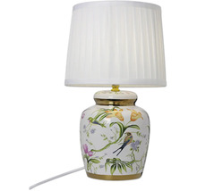 Bordslampa med keramisk fot dekorerad med blommigt fågelmotiv och vit lampskärm i tyg