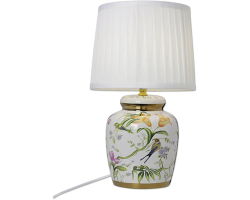 Bordslampa med keramisk fot dekorerad med blommigt fågelmotiv och vit lampskärm i tyg