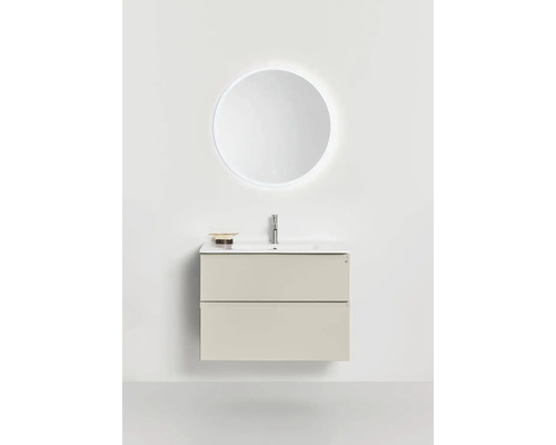 Modernt tvättställsskåp med två lådor, tvättställ, blandare och upplyst rund väggspegel för ett minimalistiskt badrum.