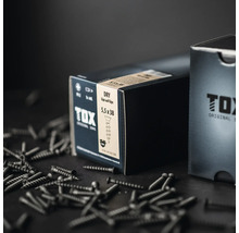 Tox Dry gips på gips gipsskruv 5,5 gånger 38 millimeter i en produktförpackning med skruvar på ytan.
