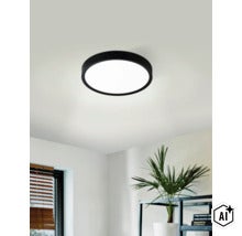 Modern rund LED taklampa med platt design och matt yta monterad i vardagsrum. (Image AI modified or generated)