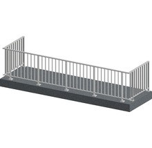 Metallräcke på en betonggrund
