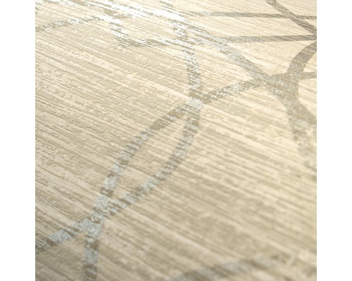 Närbild av en beige vinyltapet med cirkulärt mönster