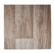 Bit laminatgolv med autentiskt träutseende och ådring för en naturlig inredningsdesign.