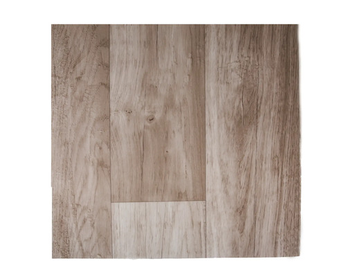 Bit laminatgolv med autentiskt träutseende och ådring för en naturlig inredningsdesign.