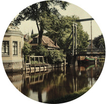 Landskap med kanal, bro och hus