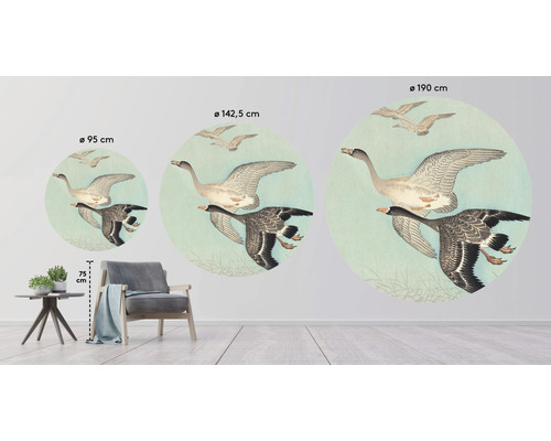 Väggdekoration med flygande gäss i olika storlekar i en rumsmiljö