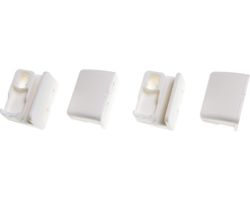 Fyra plasthållare för möbelkopplingar