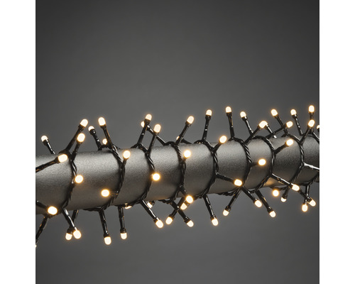 Ljusslinga KONSTSMIDE cluster frostad 600 bärnstensfärgade LED svart kabel 30V/IP44 Ljusslinga med varmvita LED-lampor lindad runt en stång