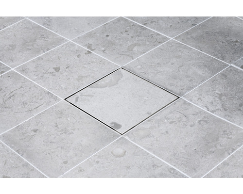 Kakelgolv med fyrkantig inspektionslucka