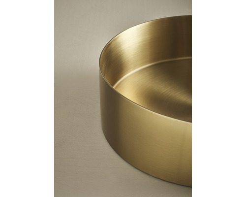 Gyllene rund planteringsskål av metall