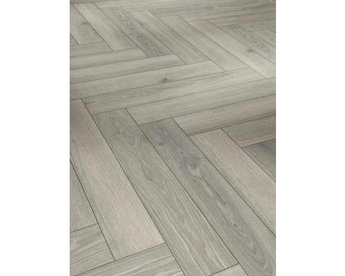 Provbit: Laminatgolv PARADOR 8.0 Studio ljusgrå ek Fiskbensparkett av trä