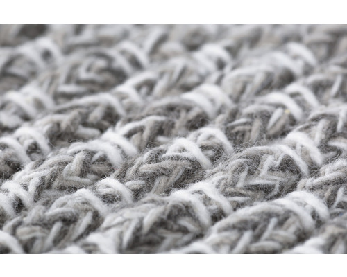 Närbild av en matta med stickat mönster